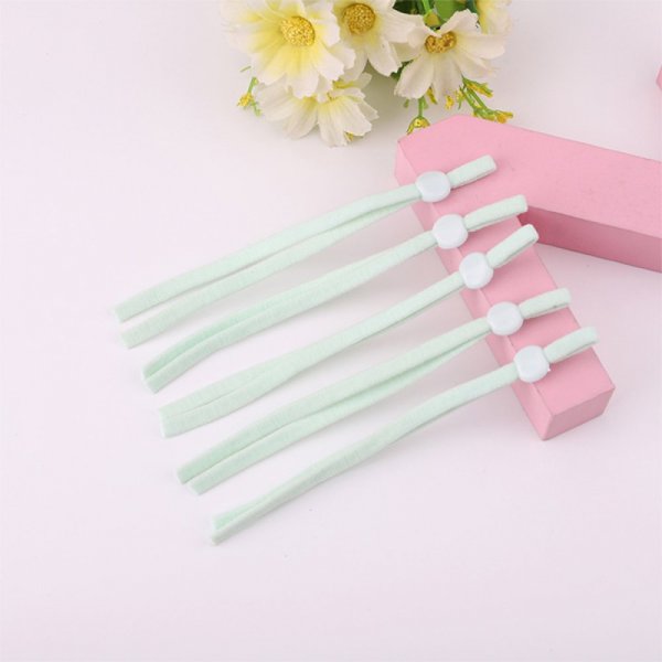 2 cintas de cord&oacute;n el&aacute;stico verde menta con lazo de sujeci&oacute;n ajustable para la mascarilla.
