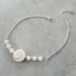 Pulsera de cuentas de ojo de Santa Lucía y nácar sobre cadena de plata 925