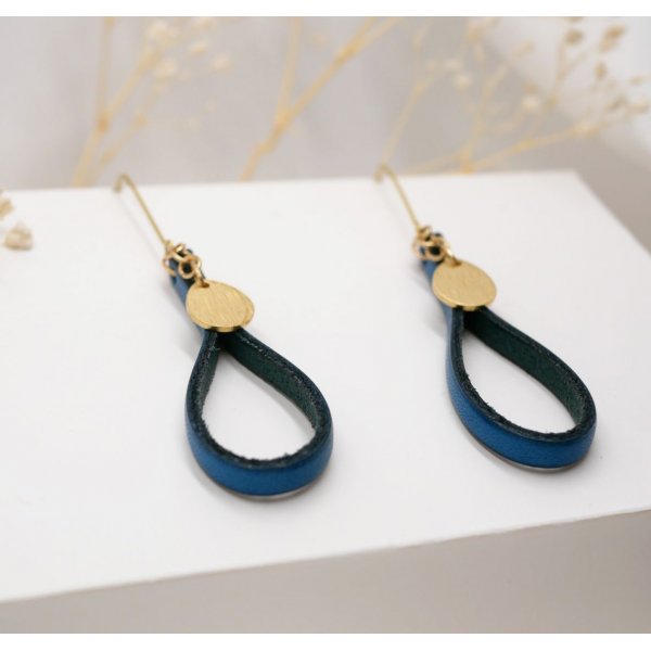 Pendientes de cuero azul con borla dorada