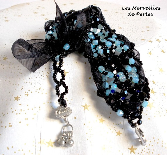 Pulsera Prestige con facetas negras y azules y cinta de organza