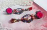 BO María y Jesús creados con cabujones de resina, peras rojas facetadas y diversos accesorios