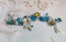 Bracelet Regard Scintillant avec fleurs frosted, clochettes verres, rondes résines, breloques et perles Cristal Swarovski
