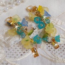 BO Bella Amarillo montado con cristales de Swarovski, flores esmeriladas y perlas 