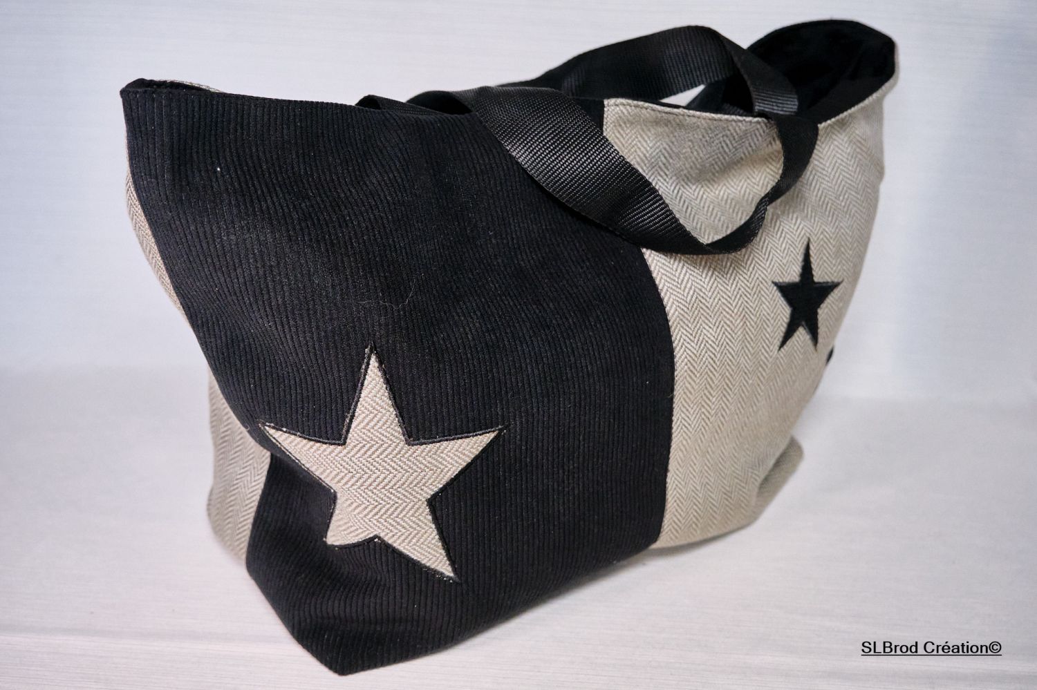 Sac cabas bi-matière noir et gris avec étoiles